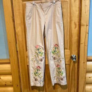 Venus tan dress pants with flower embellishment, size 4.